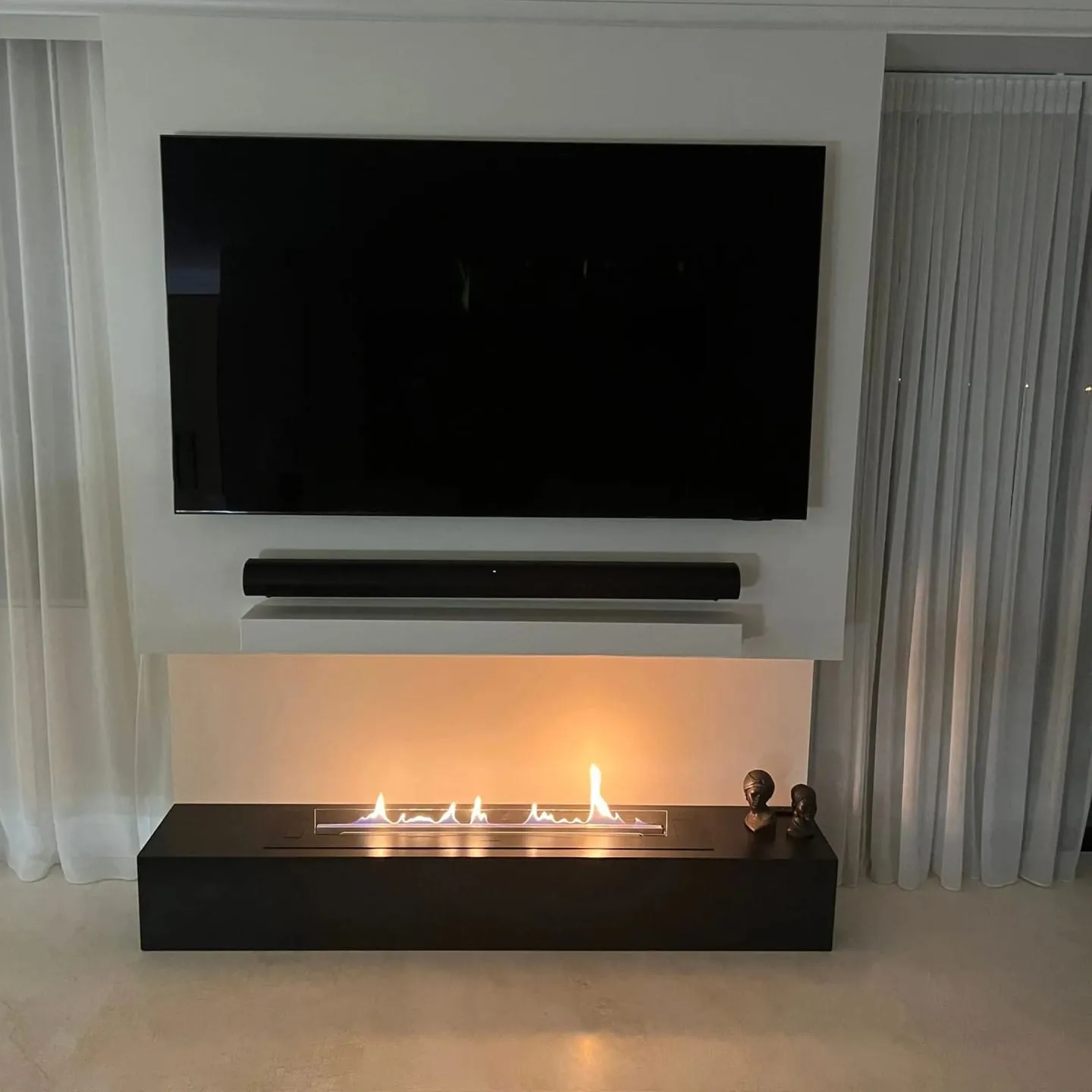 A completed Decoflame BEV fireplace installation beneath a wall-mounted TV in Elizabeth Bay, Sydney