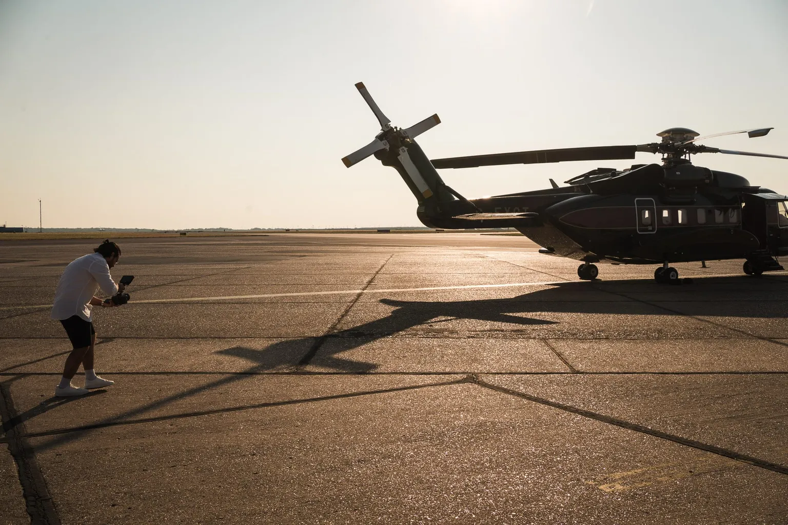 Filming a helicopter on an airfield at sunset for a client project