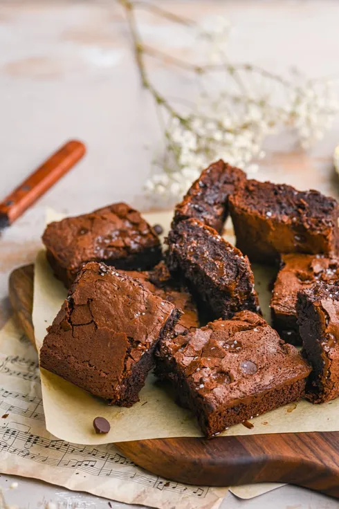 Chocolate chip brownies on a wooden board from Marley's Menu