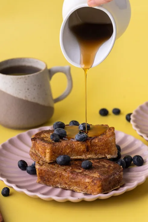 French toast stacked with blueberries and maple syrup from Marley's Menu