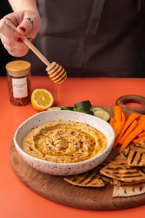 Hummus platter with grilled pita and vegetables from Marley's Menu