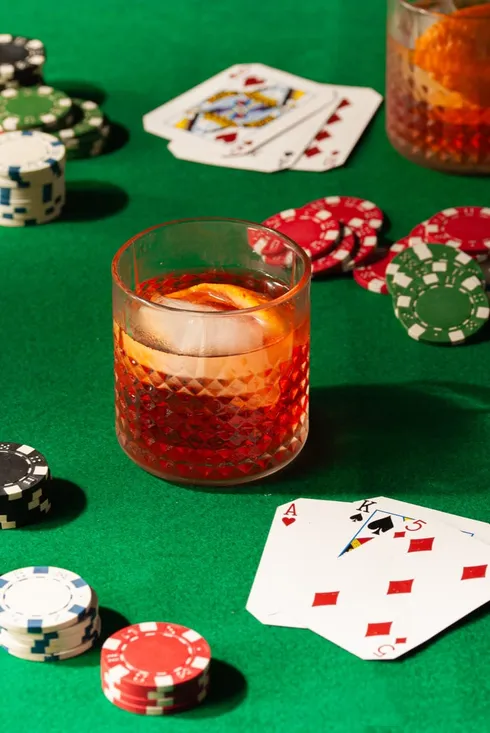 Negroni cocktail styled on a poker table from Marley's Menu