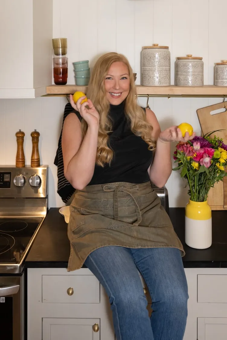 Marley Goldin holding lemons in her kitchen while recipe testing