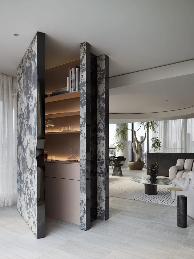 A sculptural stone bar with backlit shelving in a Studio Terrando penthouse project