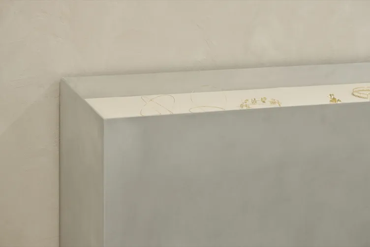 Fine gold bridal jewellery displayed on a brushed steel counter at The Fall Bride