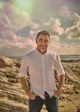 Guy Davies standing on coastal rocks in Sydney