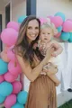 Restorative Roots founder Holly Stein holding her daughter Blaire
